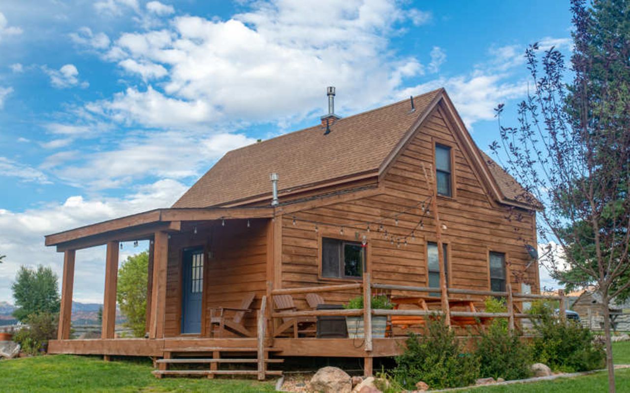 Cabins at Cottonwood Meadow Lodge | Photo Gallery | 0 - The Farmhouse - Sleeps 8 The Farmhouse is perfect for larger groups. 3 bedrooms with 4 queen-sized beds, 3 private bathrooms, open and airy living room, and a fully equipped chef’s kitchen, complete with a Viking range provide all the comforts of home.