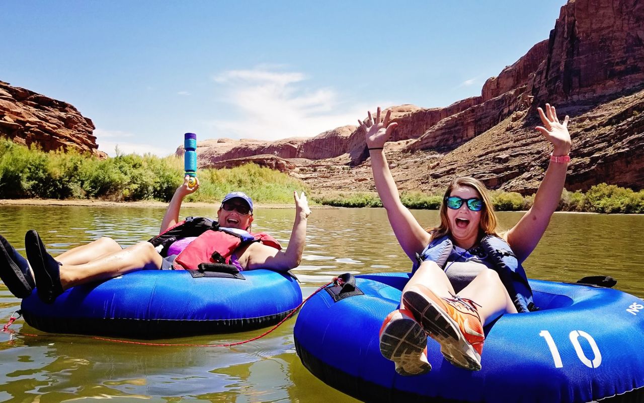 Canyonlands By Night & Day | Photo Gallery | 4 - Enjoy the stunning red rock cliff walls as you float past them either on a tube or on a Stand-up Paddle Board (SUP) for a half or full-day rental on the Colorado River.