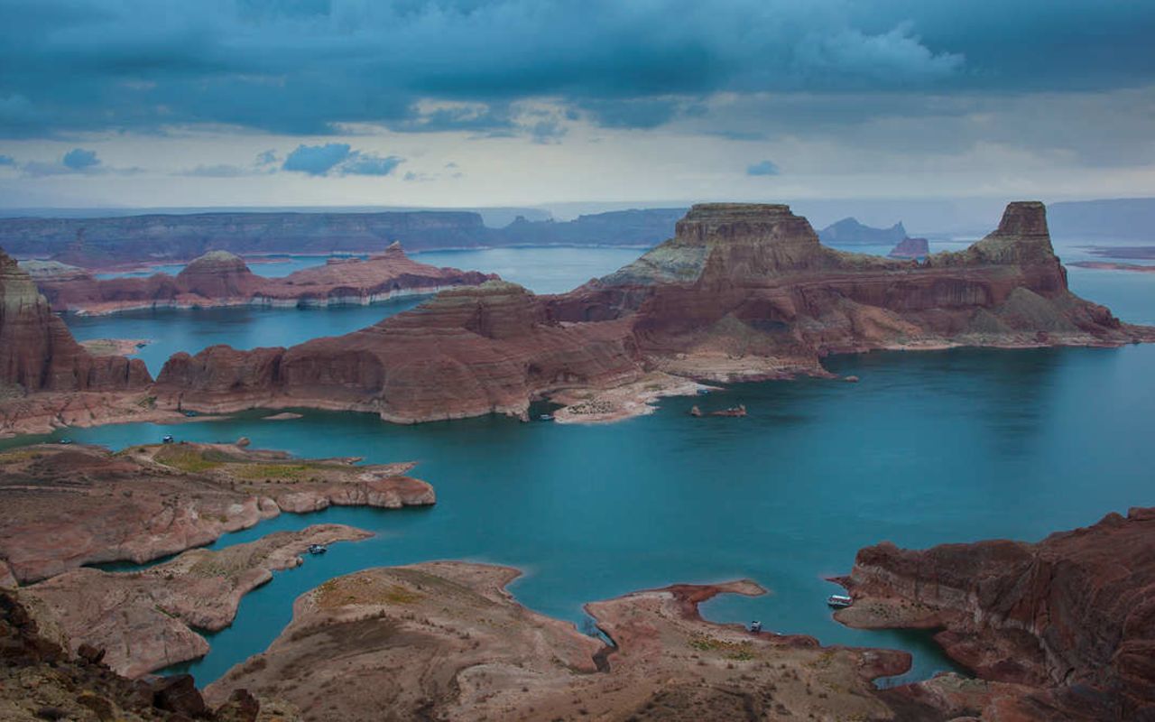 Lake Powell | Photo Gallery | 3 -  We think of Lake Powell as a paradise for boating, waterskiing, fishing, camping, hiking, and exploring the Glen Canyon National Recreation Area. It straddles the border between Utah and Arizona. It's definitely a place to add to your bucket list.