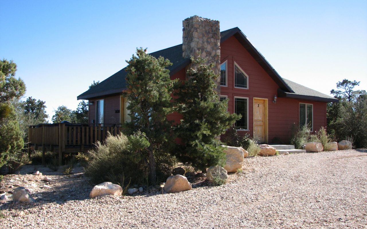 Stone Canyon Inn | Photo Gallery | 4 - Cabins Each cabin has two bedrooms, two baths, a full kitchen, living room with sofa bed and hot tub on a private deck. Each bedroom has one king and one queen bed.