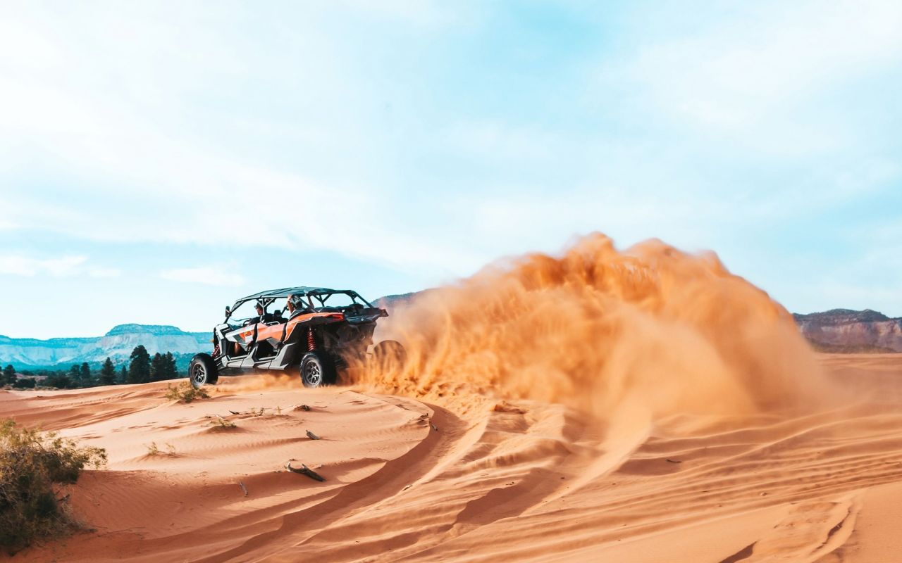 ROAM Outdoor Adventure Co | Photo Gallery | 1 - ATV Peek-A-Book Tour Take an adrenaline pumping ATV ride through sand dunes to one of the most beautiful and legendary slot canyons in the area!