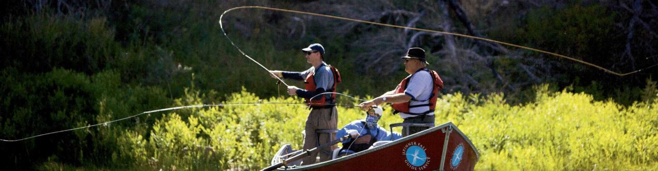 Flaming Gorge Guides & Rentals | Photo Gallery | 1 - Men fly fishing from a boat in the Green River