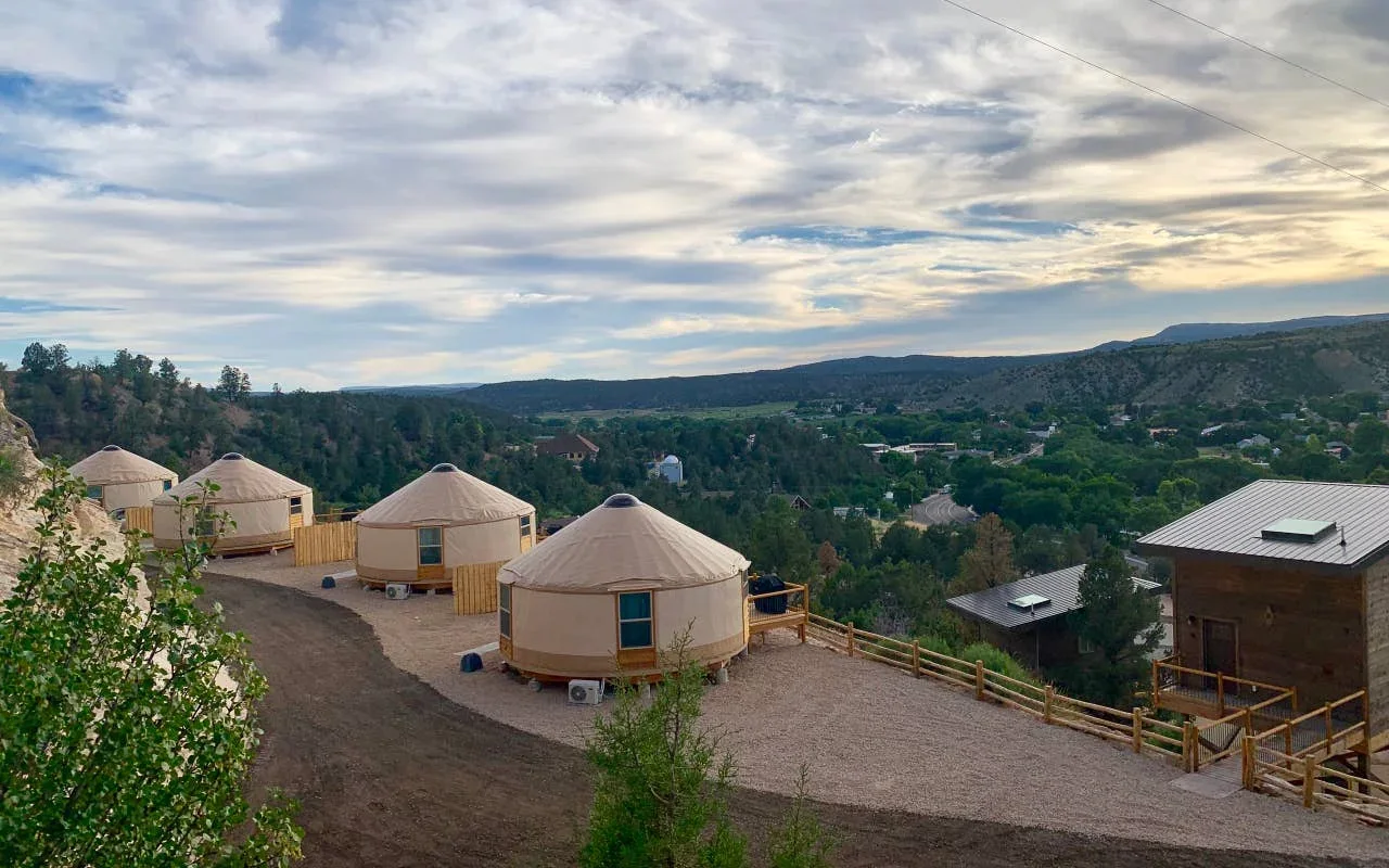 Amenities such as a microwave, coffeemaker, two-burner electric stove, small refrigerator and freezer, dishes, and pots and pans are included in each yurt. 