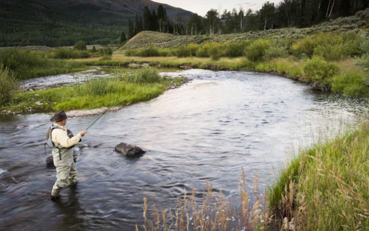 Park City | Photo Gallery | 3 - Man standing in river fly fishing