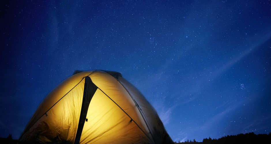 Lit up tent at night