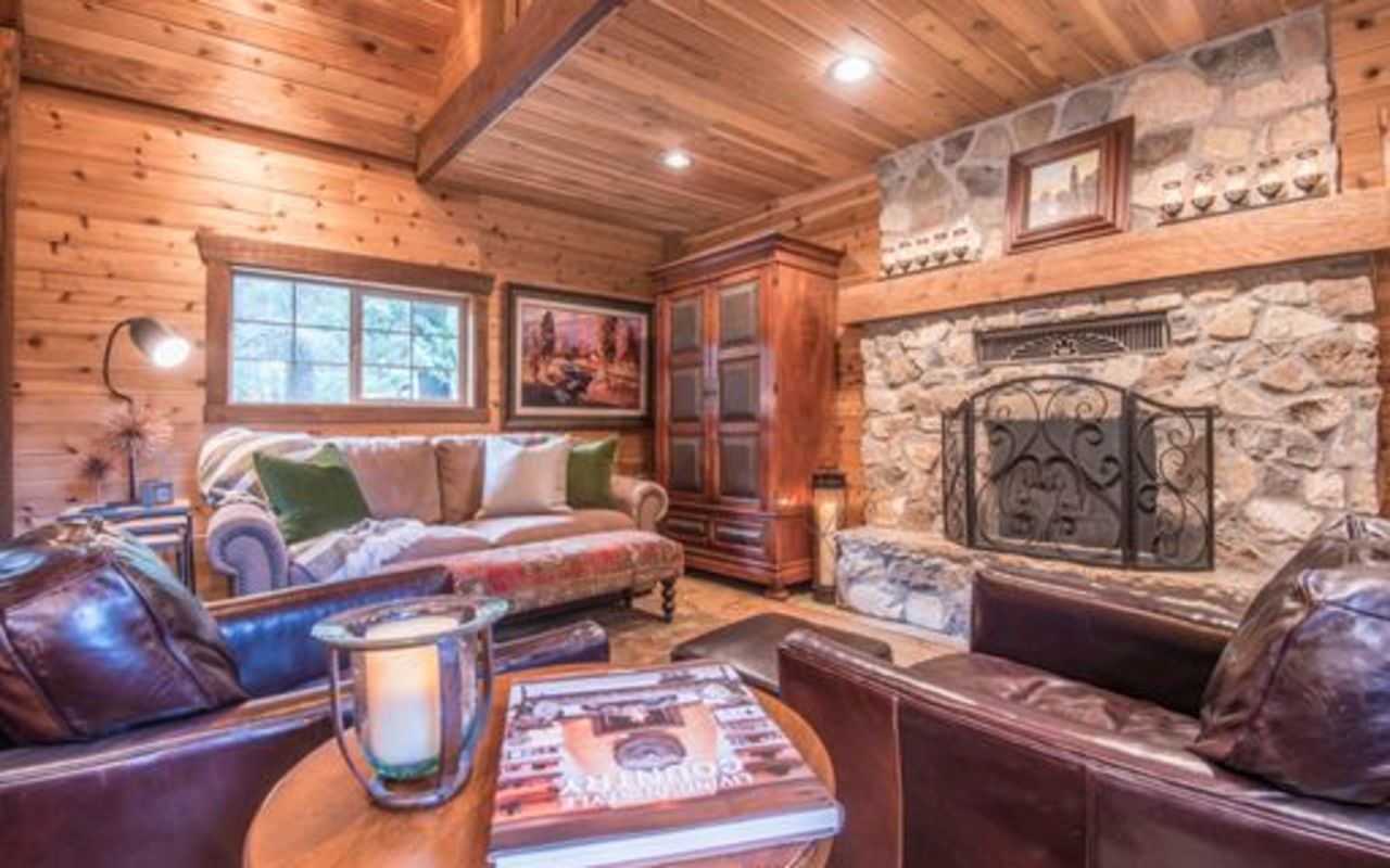 Stewart Mountain Lodging | Photo Gallery | 3 - Wee Cottage in the Woods 1 Bedroom | 1 Bath | Sleeps 4 | Pets Allowed from $450/night Amenities include a wood burning fire place, hot tub, wifi, guest massage, bathrobes, and more.
