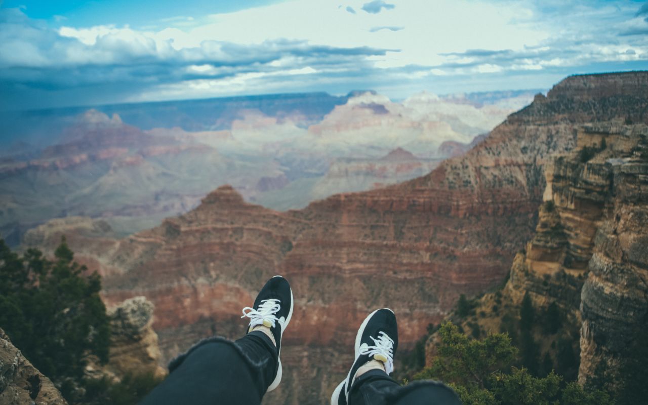 South Rim of the Grand Canyon | Photo Gallery | 0 - Sitting on the edge of the South Rim trail of the Grand Canyon National Park in Arizona