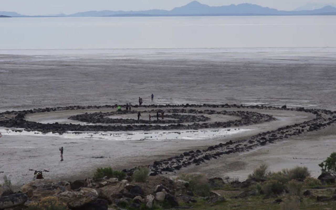 Lake Bonneville Region | Photo Gallery | 1 - View of people walking out by the Spiral Jetty in the Great Salt Lake