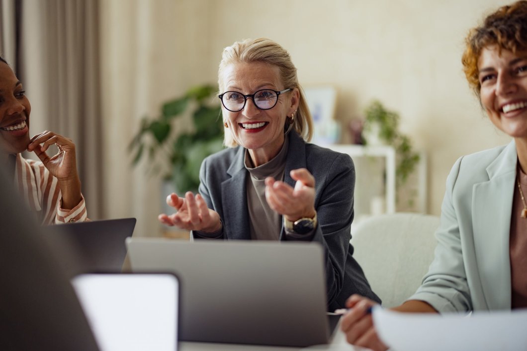 Company leadership discussing stop loss insurance in an office