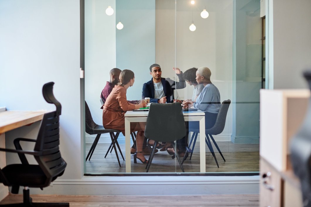 A group of colleagues discussing how to prevent bias