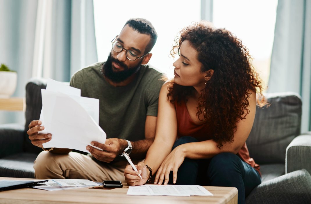 A couple reviewing their finances at home