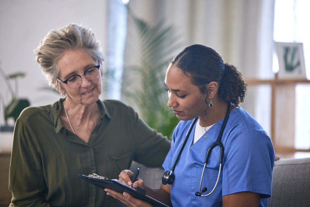 A medical professional talking with a patient
