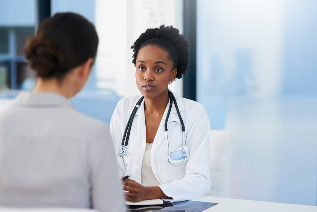 A female doctor talking to her patient.