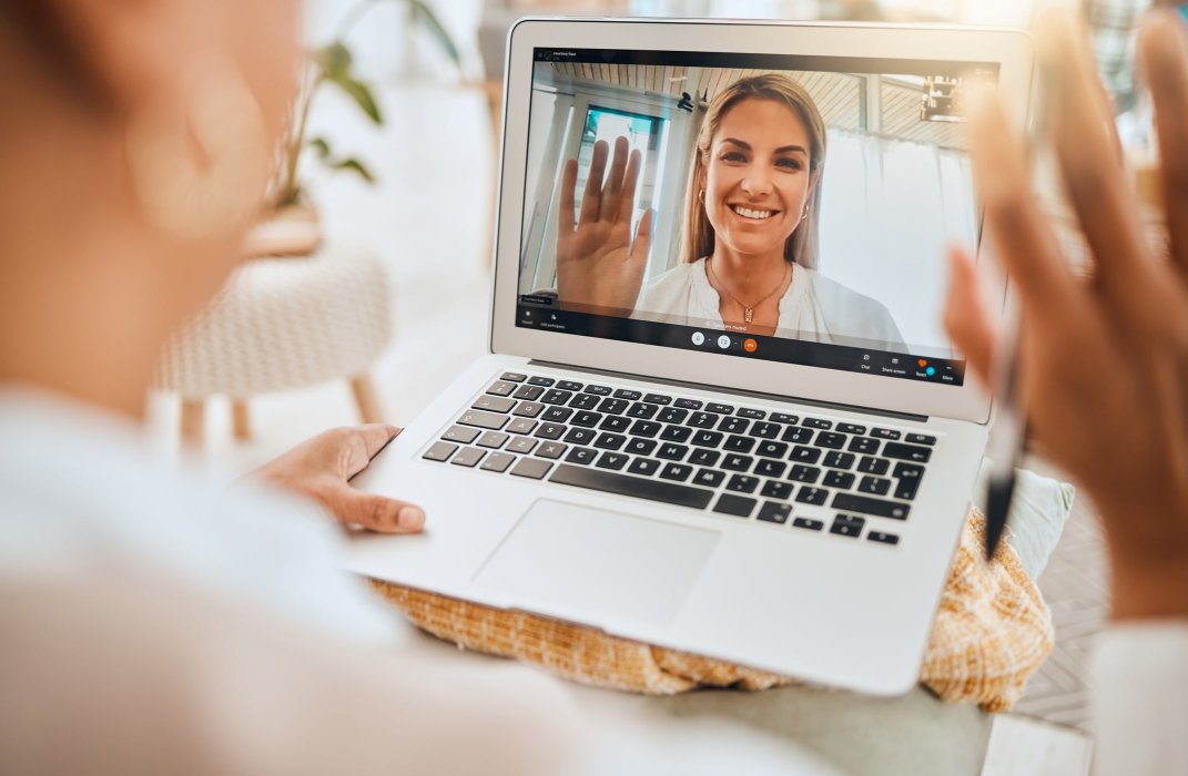 A woman meeting with her speech therapist virtually