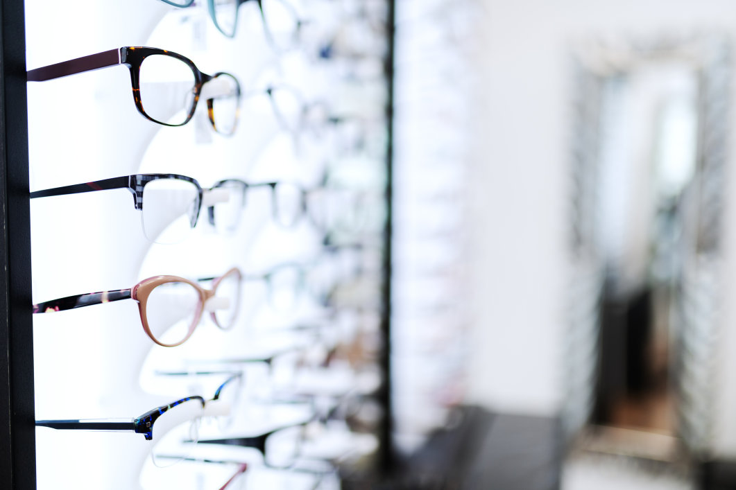 Eyeglasses displayed on a shelf