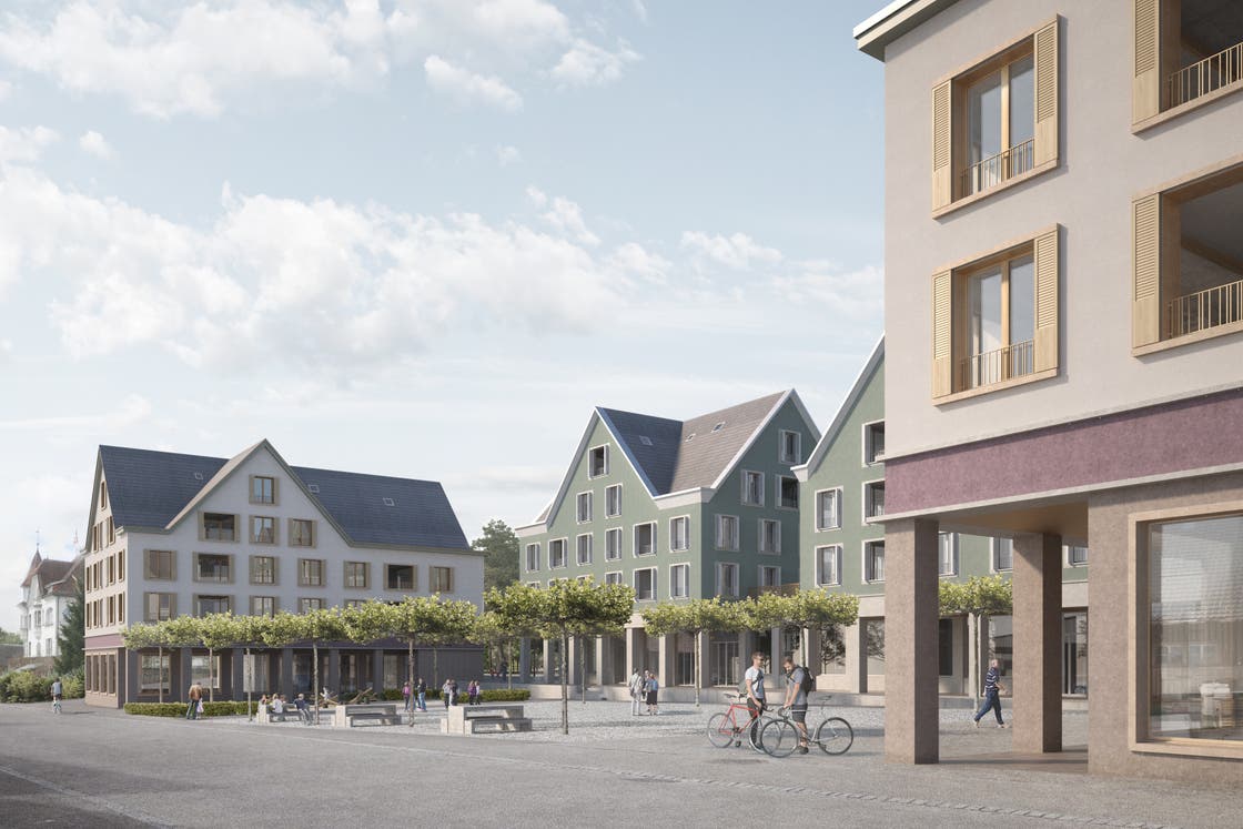 Der Eingang zum Migros-Supermarkt befindet sich im linken der beiden grünen Gebäude.