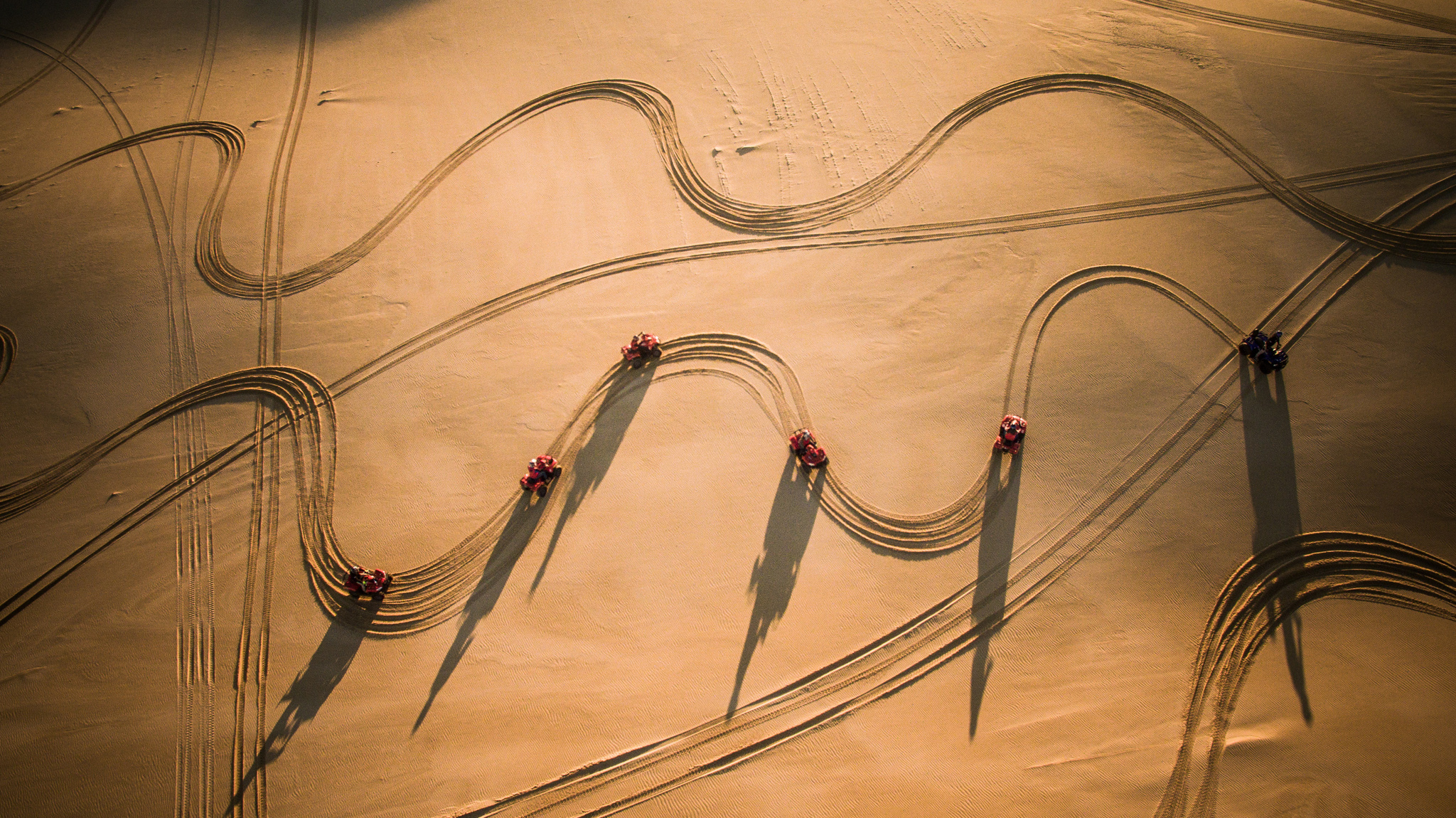 Aerial shot of quad bikes on a Sand Dune Adventures tour, NSW © Tourism Australia