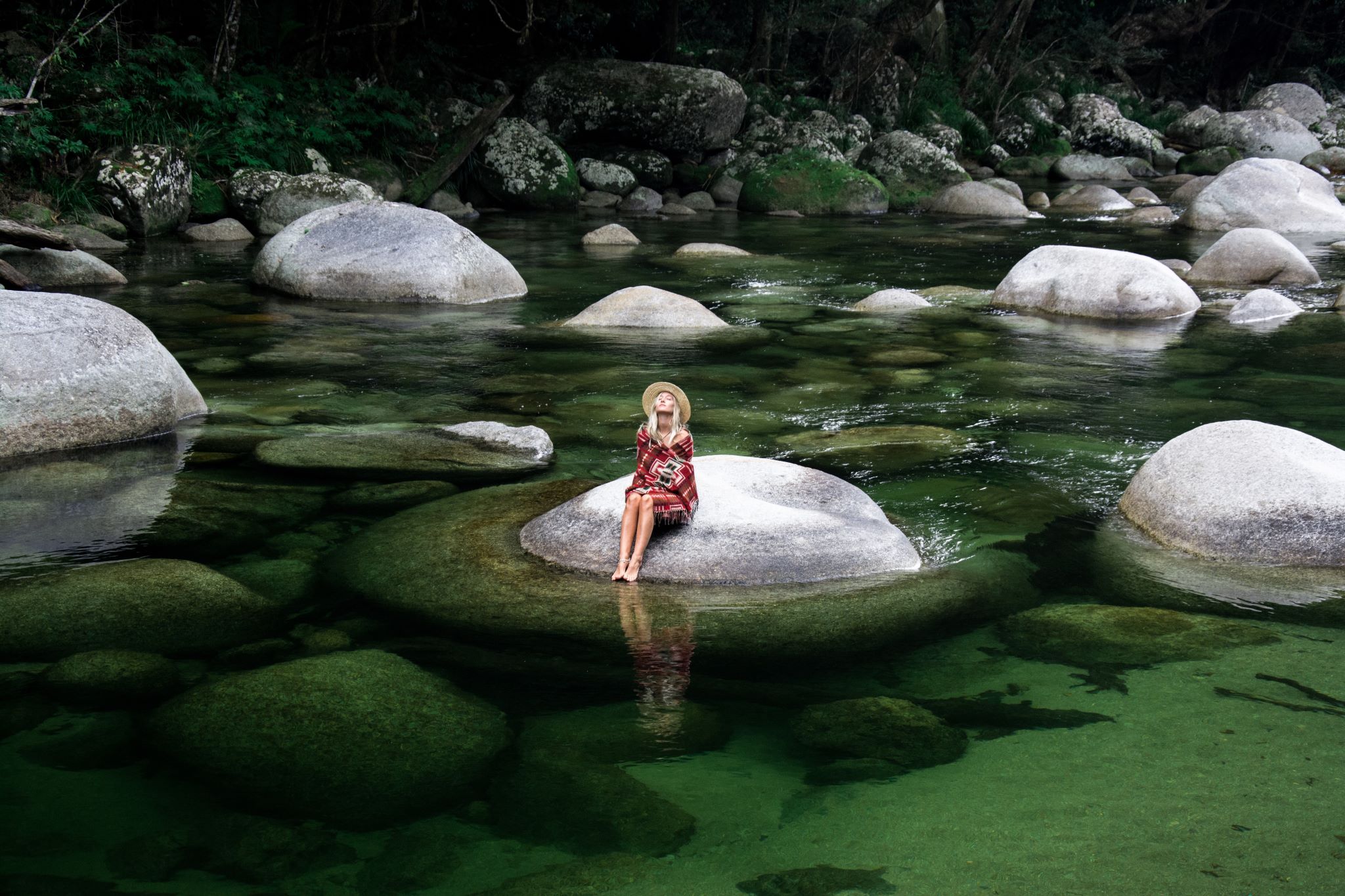 Getting ready to dive in to a waterhole in Mossman Gorge © Tourism Australia