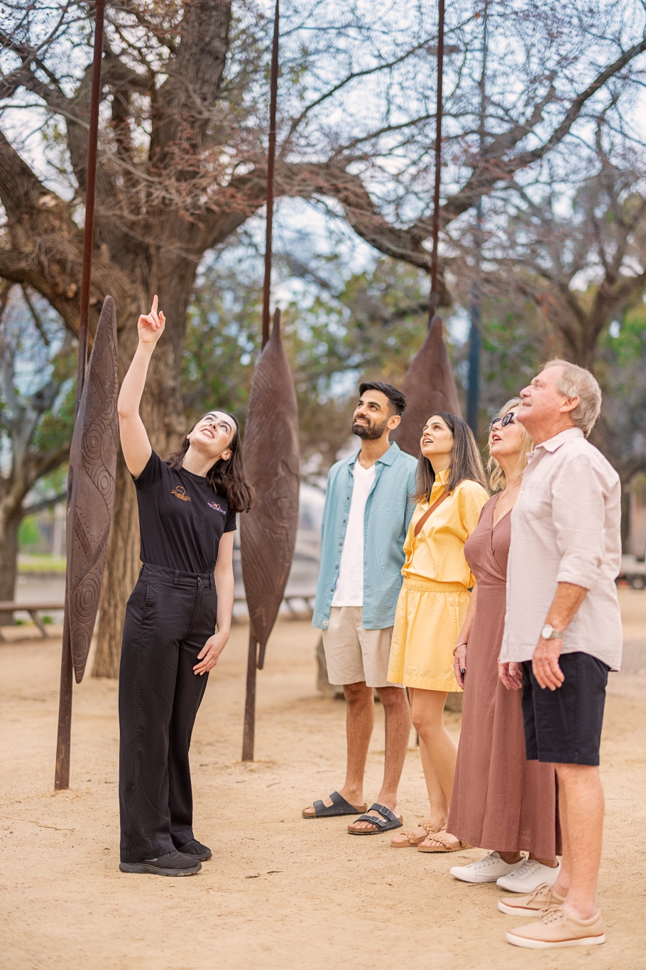 A Koorie Heritage Trust guide taking a couple for a walking tour around central Melbourne/Narrm, VIC © Visit Victoria 