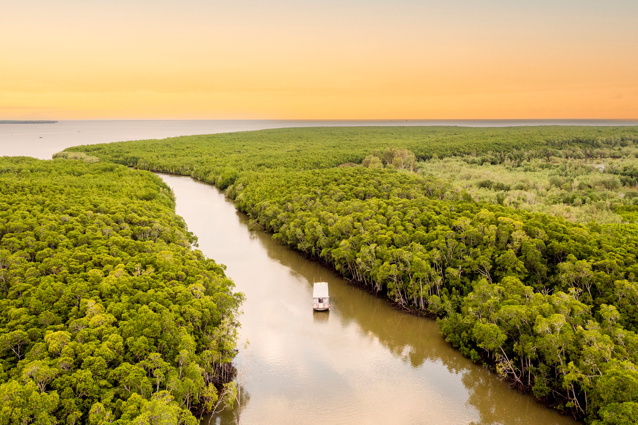 Cruising around Cairns in Queensland, learning about Sea Country with Mandingalbay Authentic Indigenous Tours © Tourism Australia