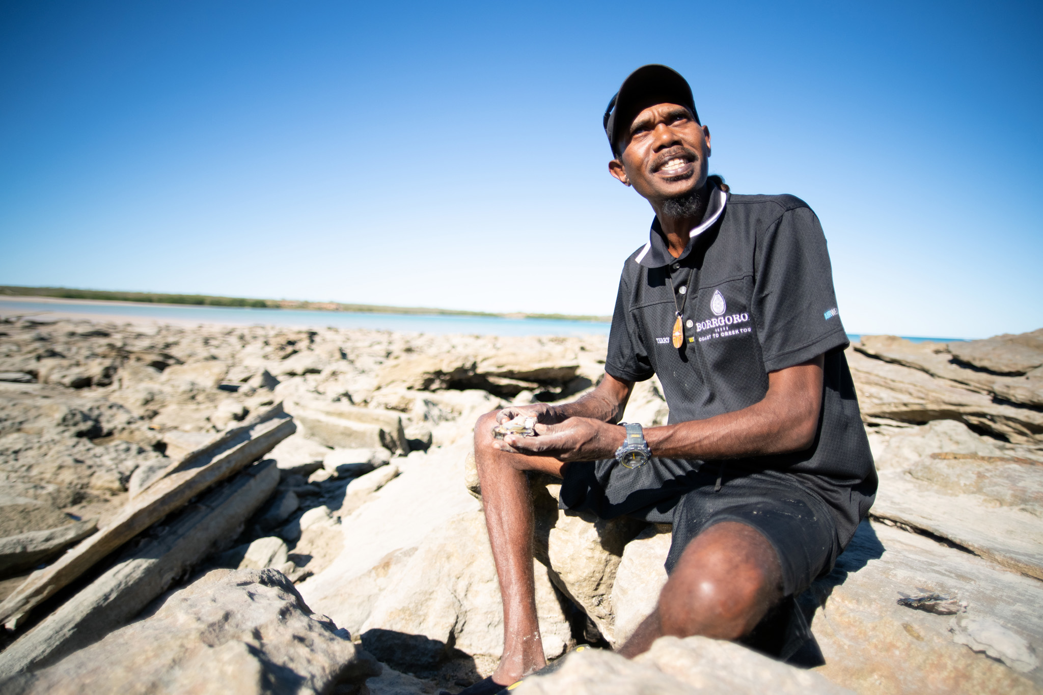 Borrgoron Coast to Creek Tours guide, Terry Hunter, looking for pearls in Cygnet Bay, WA © Tourism Western Australia 
