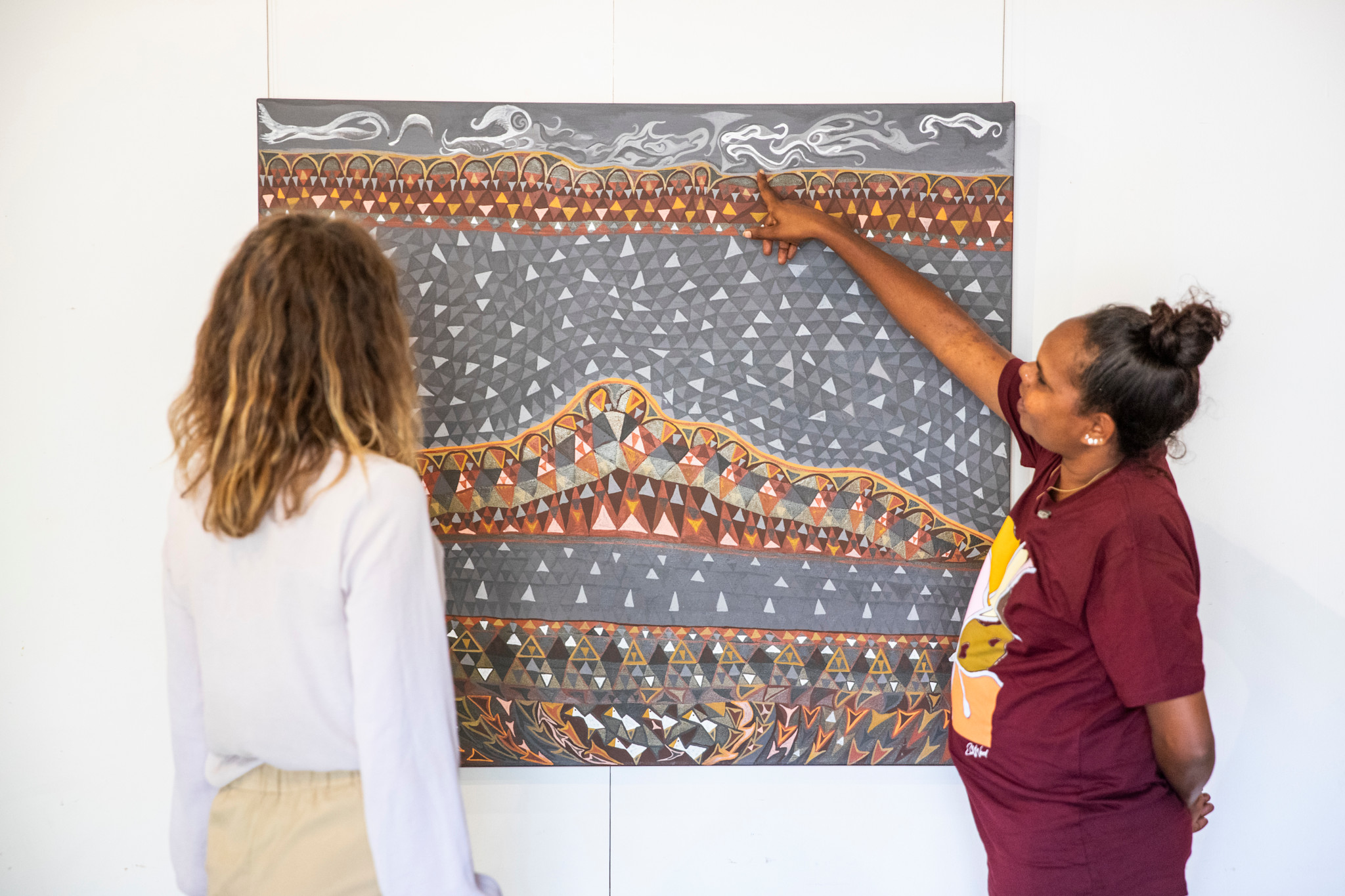 Artist showcasing local works at Waringarri Aboriginal Arts centre in Western Australia © Tourism Australia