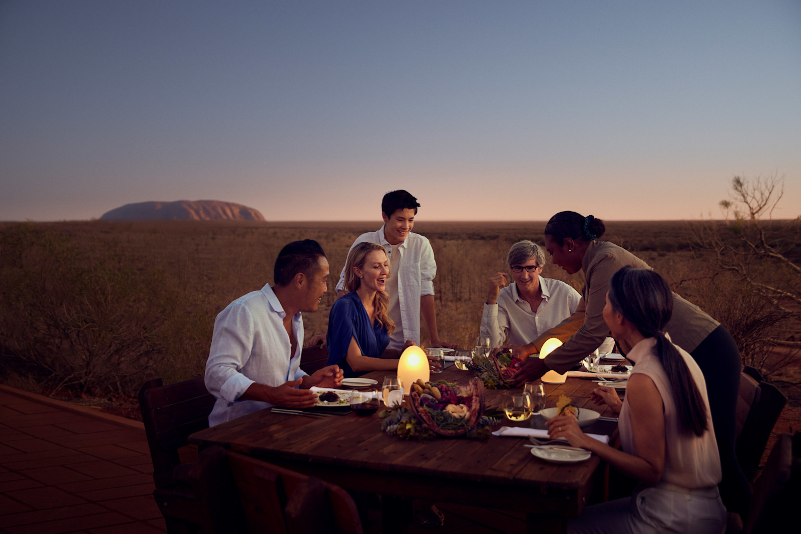 Guests enjoying the Tali Wiru fine dining experience near Uluru, NT © Voyages Indigenous Tourism Australia 