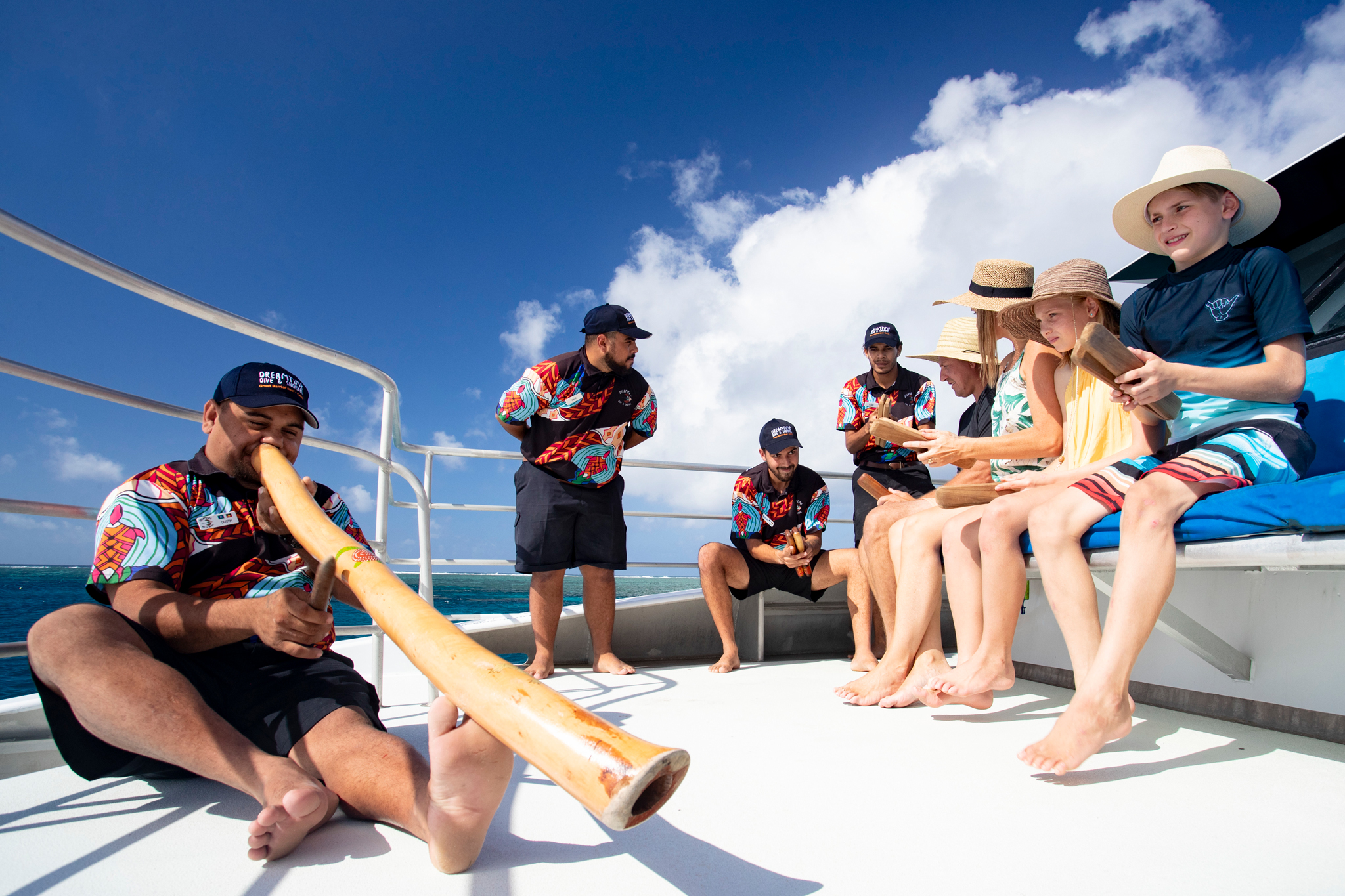 Guide playing the didgeridoo, Dreamtime Dive and Snorkel, Great Barrier Reef, Queensland