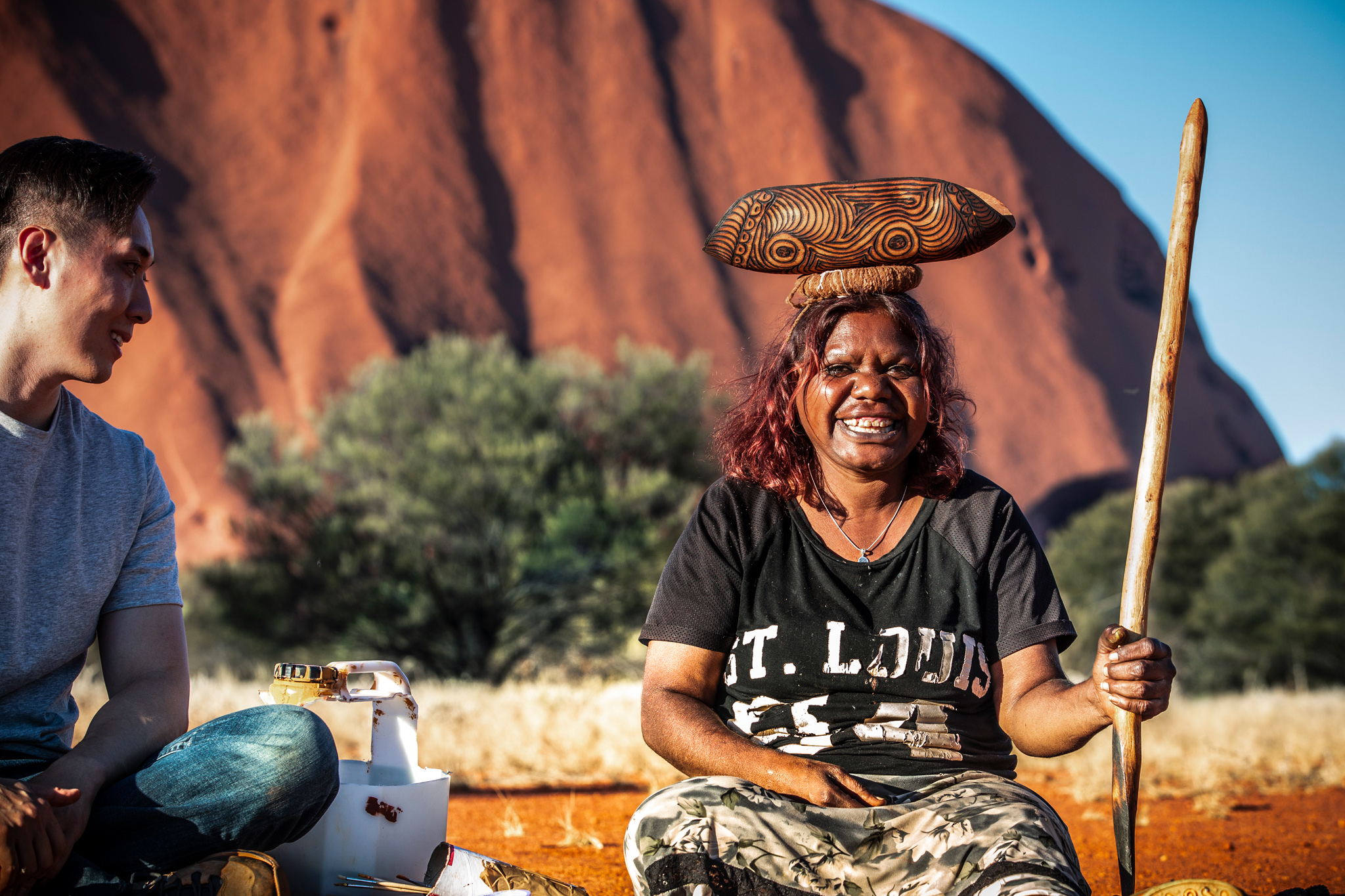 A headshot of Maruku Arts tour guide, Sarah Dalby, smiling for a photo © Tourism Australia 