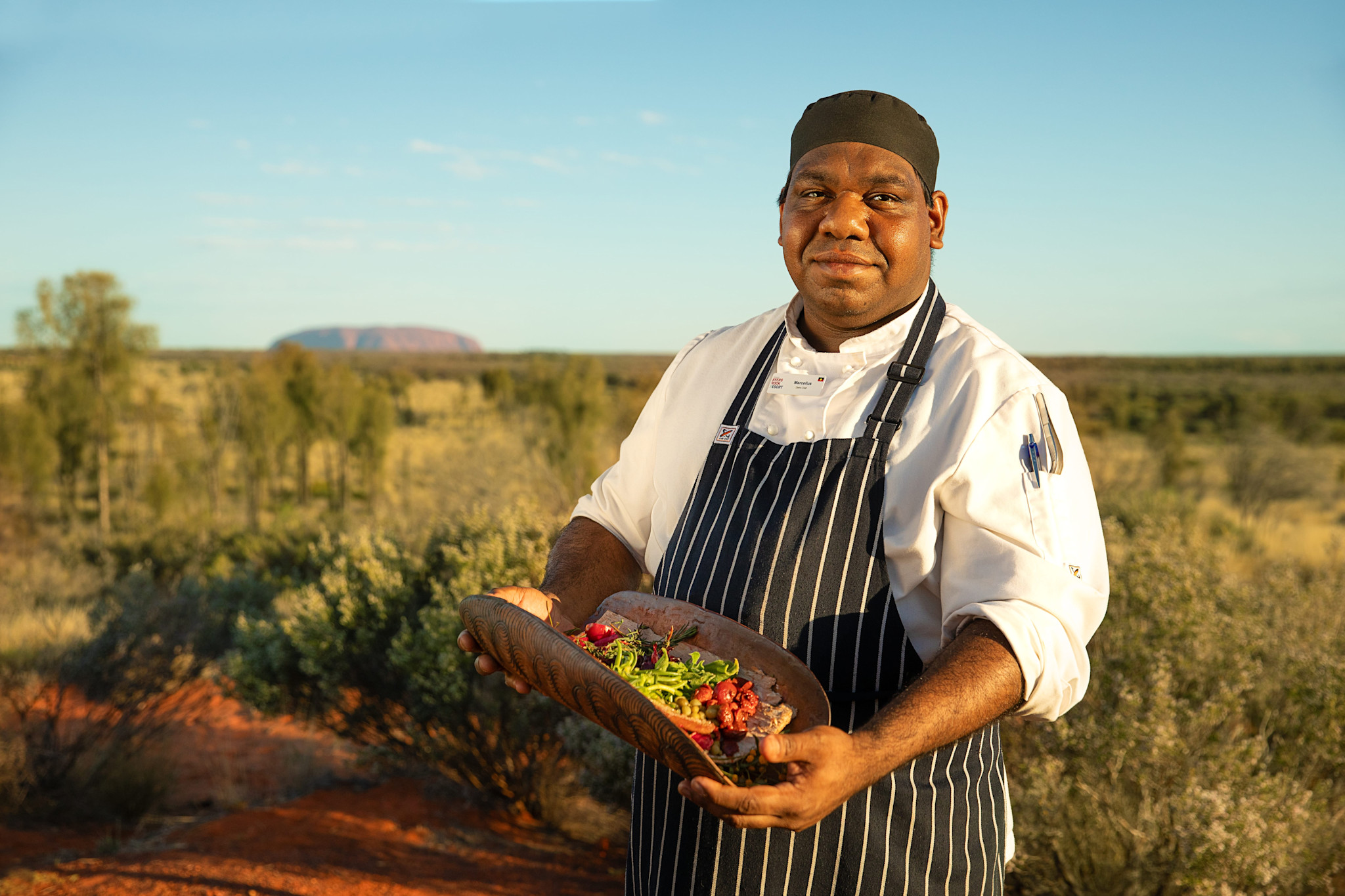 Showcasing cuisine prepared by Indigenous chefs at Voyages Tourism Australia’s Tali Wiru dining experience in the Northern Territory © Tourism Australia