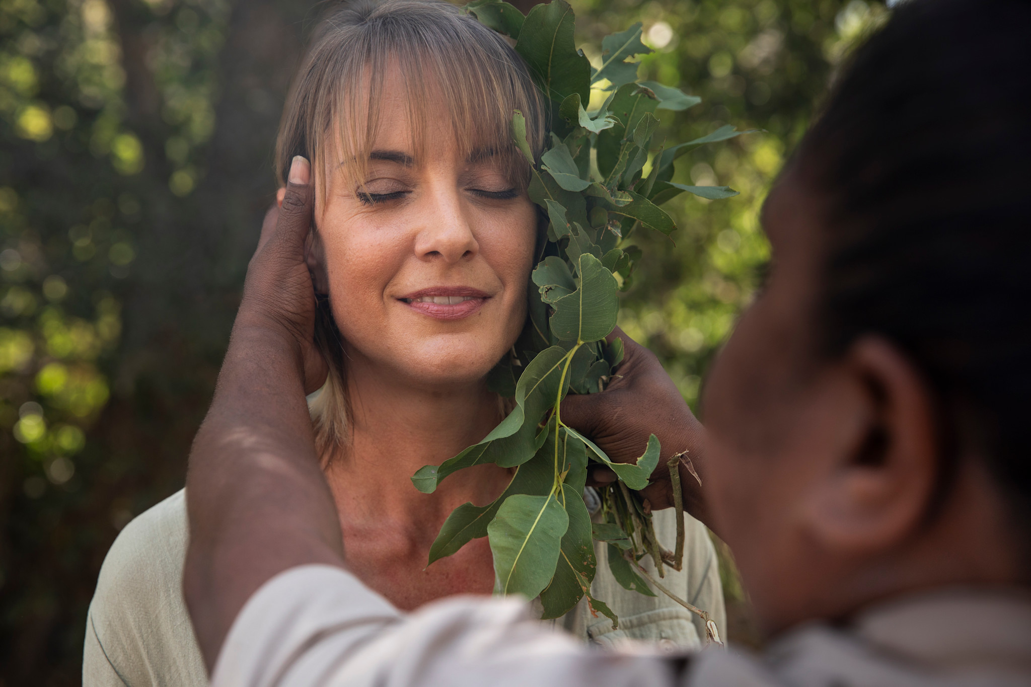 An Aboriginal guide hosting a traditional smoking ceremony during Injiid Marlabu Calls Us at El Questro in the Kimberley region of Western Australia © Tourism Australia