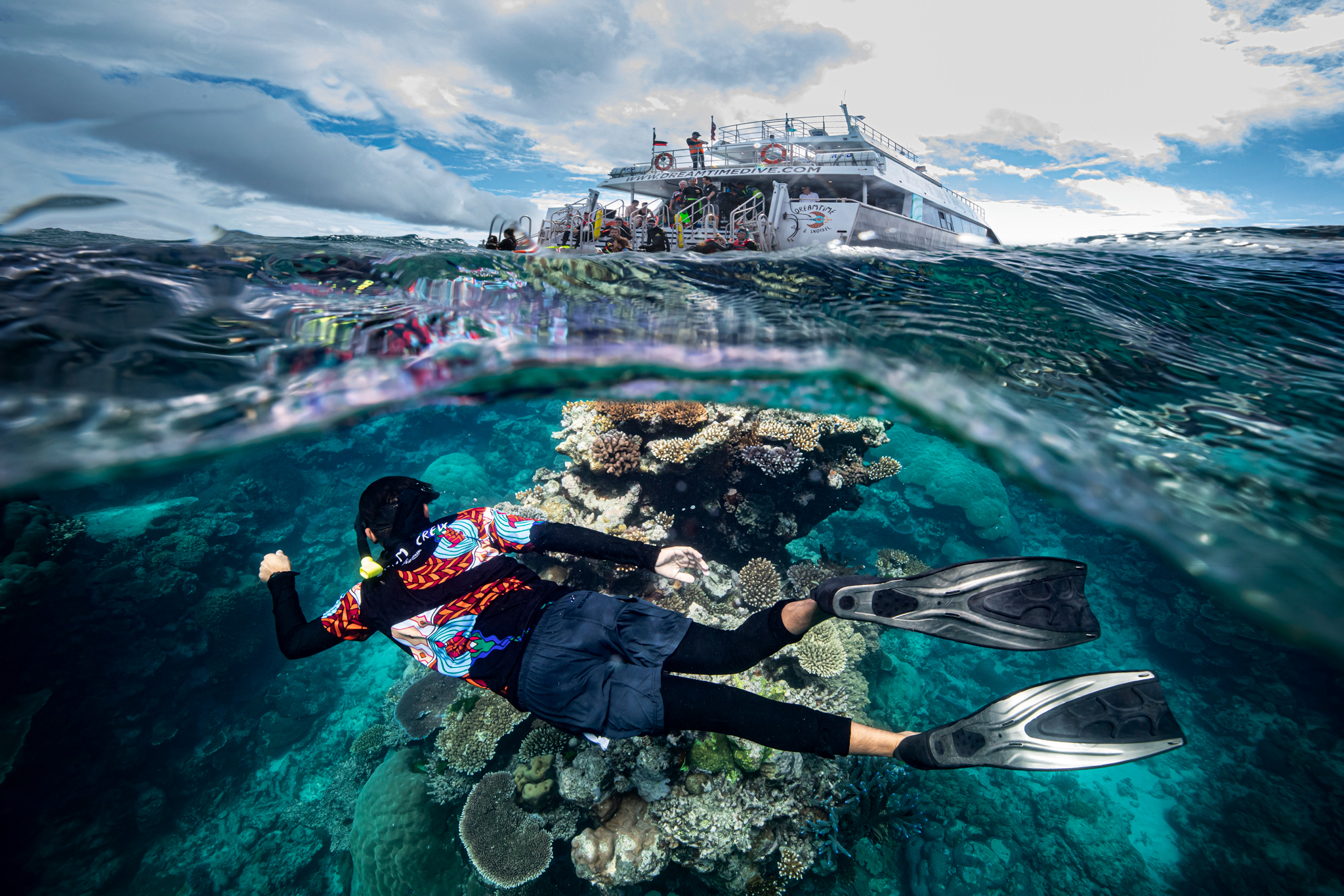 A Dreamtime Dive & Snorkel guide in the Great Barrier Reef, QLD © Tourism Australia