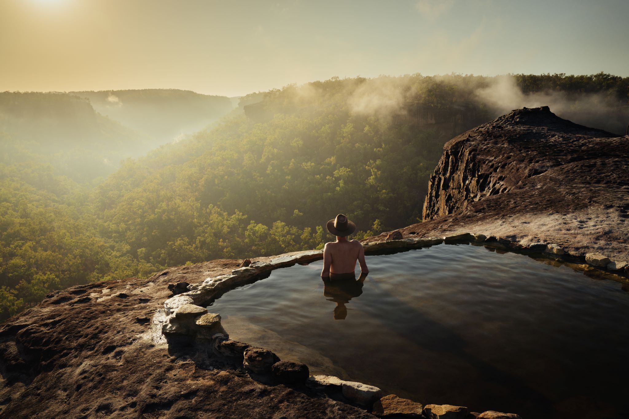 Soaking in the Queensland outback with Jarramali Rock Art Tours © Tourism Australia