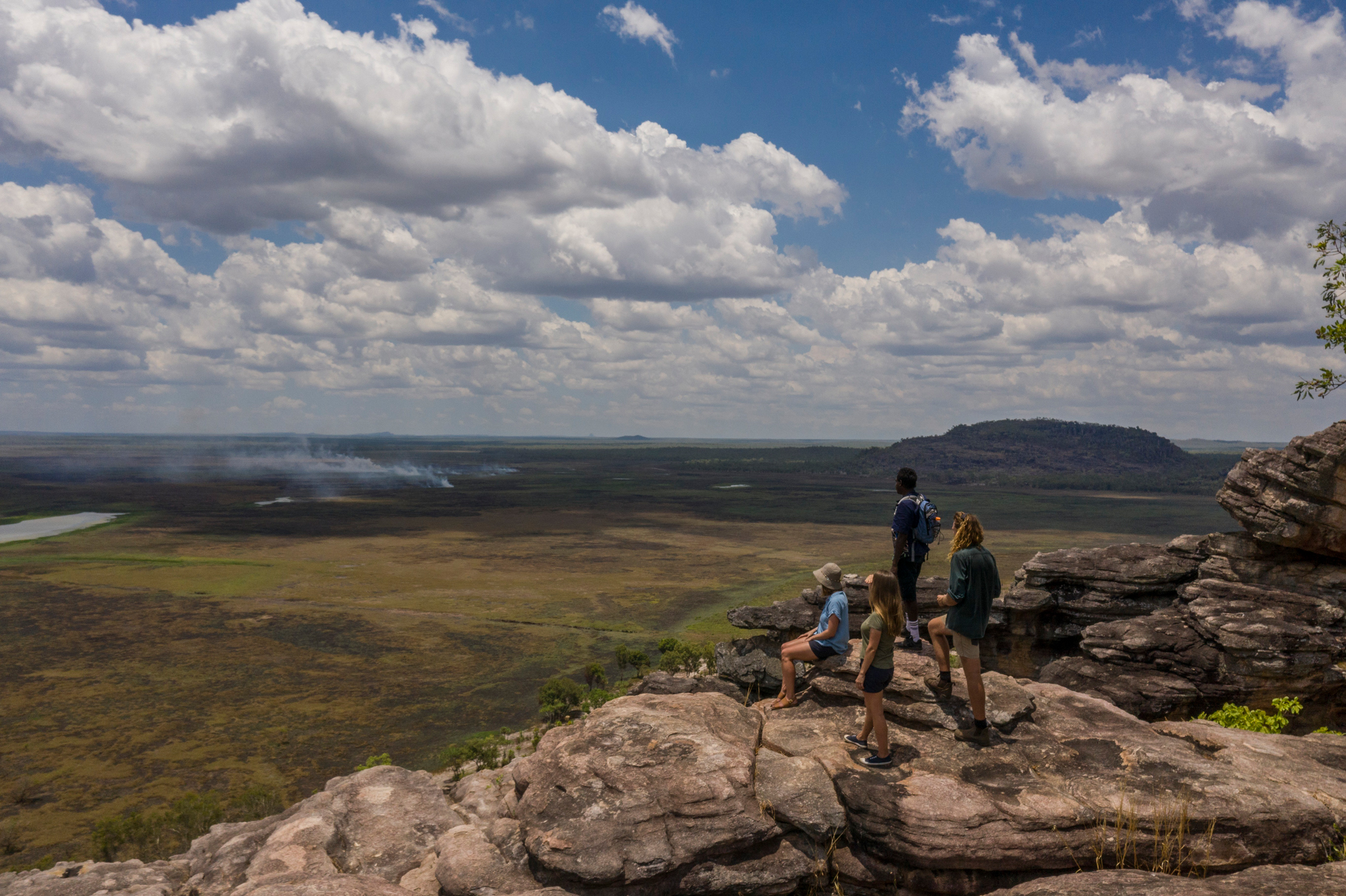 A Venture North Safaris tour guide and group looking out into the distance on an adventure tour, NT © Tourism Australia 