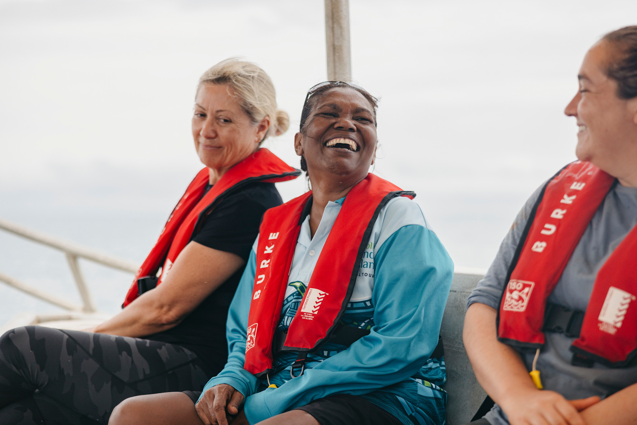 Oolin Sunday island Cultural Tours guide Rosanna Angus with guests on a cruise along the West Australian coast © Tourism Australia