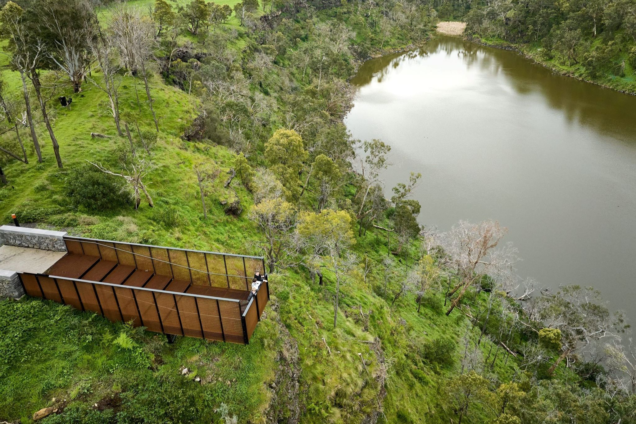 Couple taking in the view over World Heritage-listed Budj Bim, Victoria © Tourism Australia