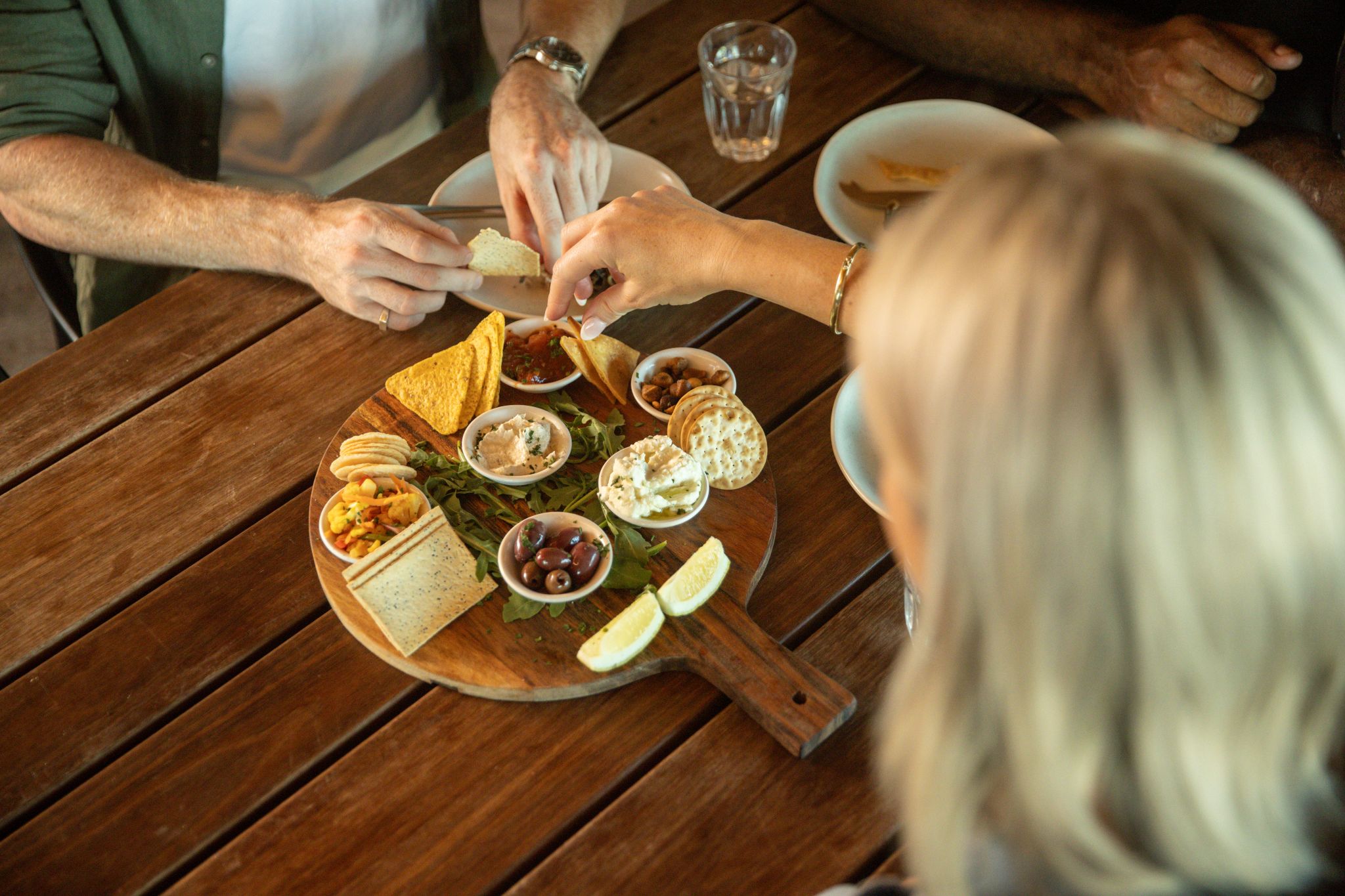 Enjoying an eel tasting platter at Budj Bim Cultural Landscape, Victoria © Tourism Australia