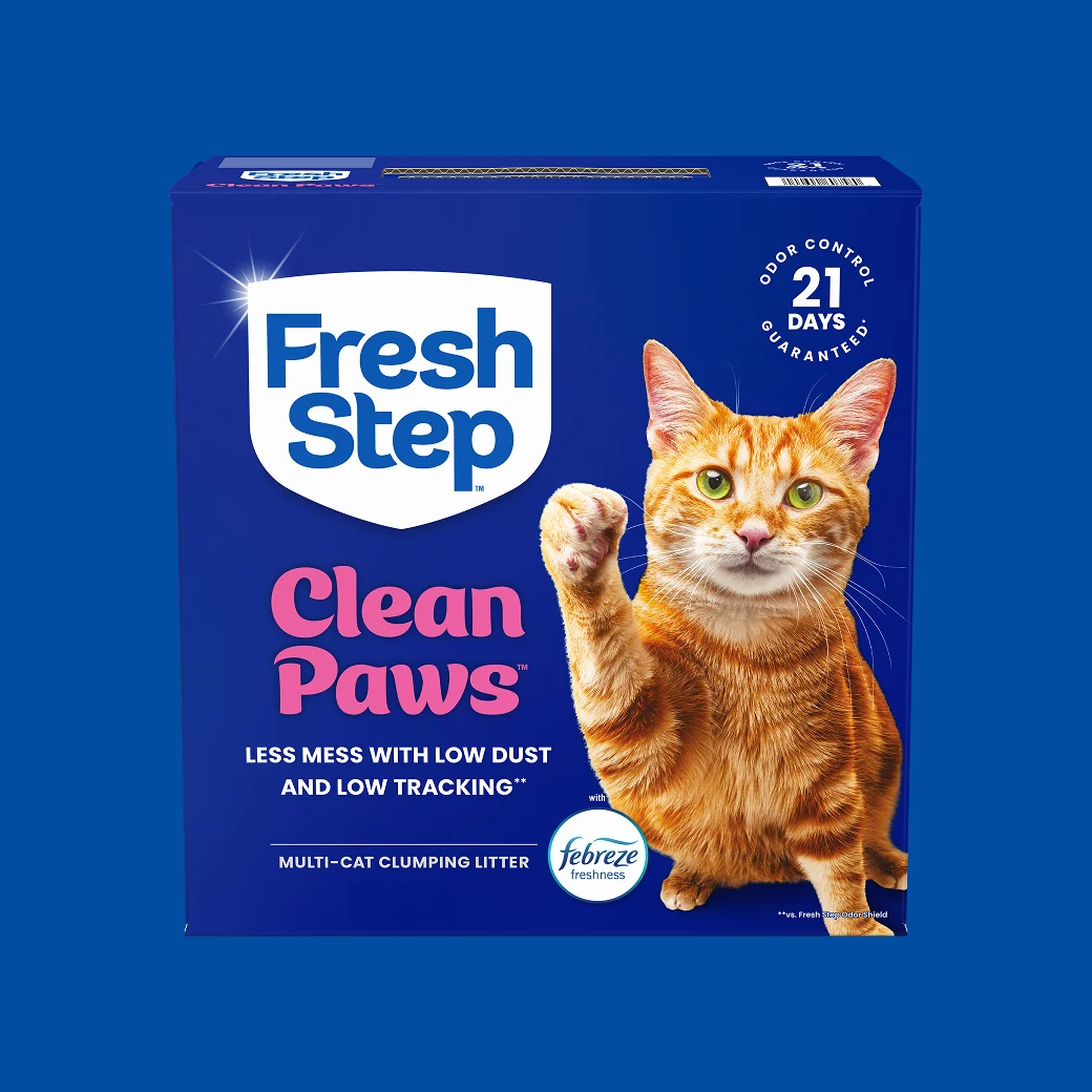A carton of Fresh Step Clean Paws scented on a blue background