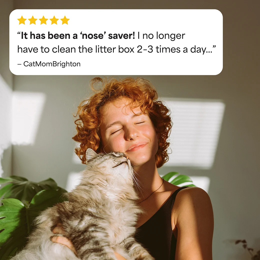 A woman snuggling her cat. The review above says "It has been a nose saver! I no long have to clean the litter box 2–3 times a day."
