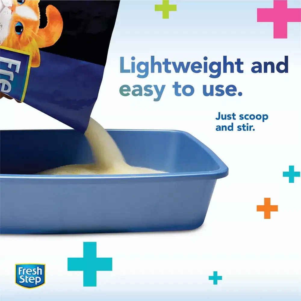 Lightweight and easy to use, just scoop and stir, cat litter being poured into a litter box