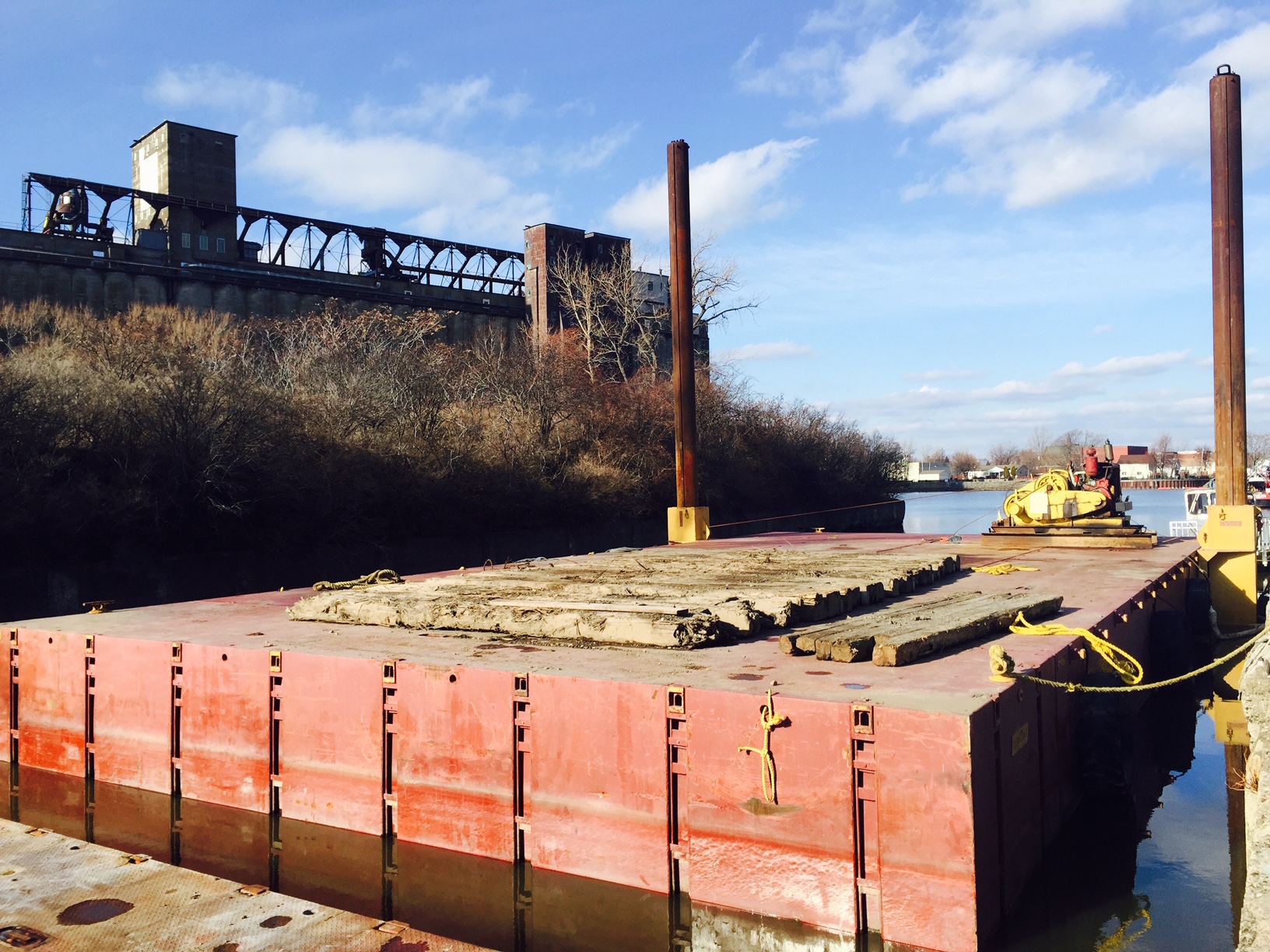 How do you get a 100’ barge delivered to a landlocked lake? Learn how