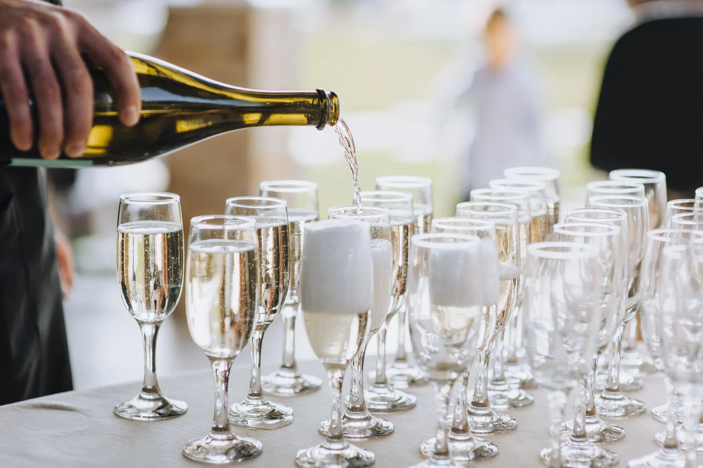 stylish-champagne-glasses-and-food-appetizers-on-table-at-wedding-picture-id961798406
