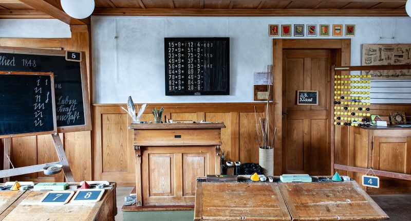 Historical schoolroom of the School Museum Bern with old benches and blackboards