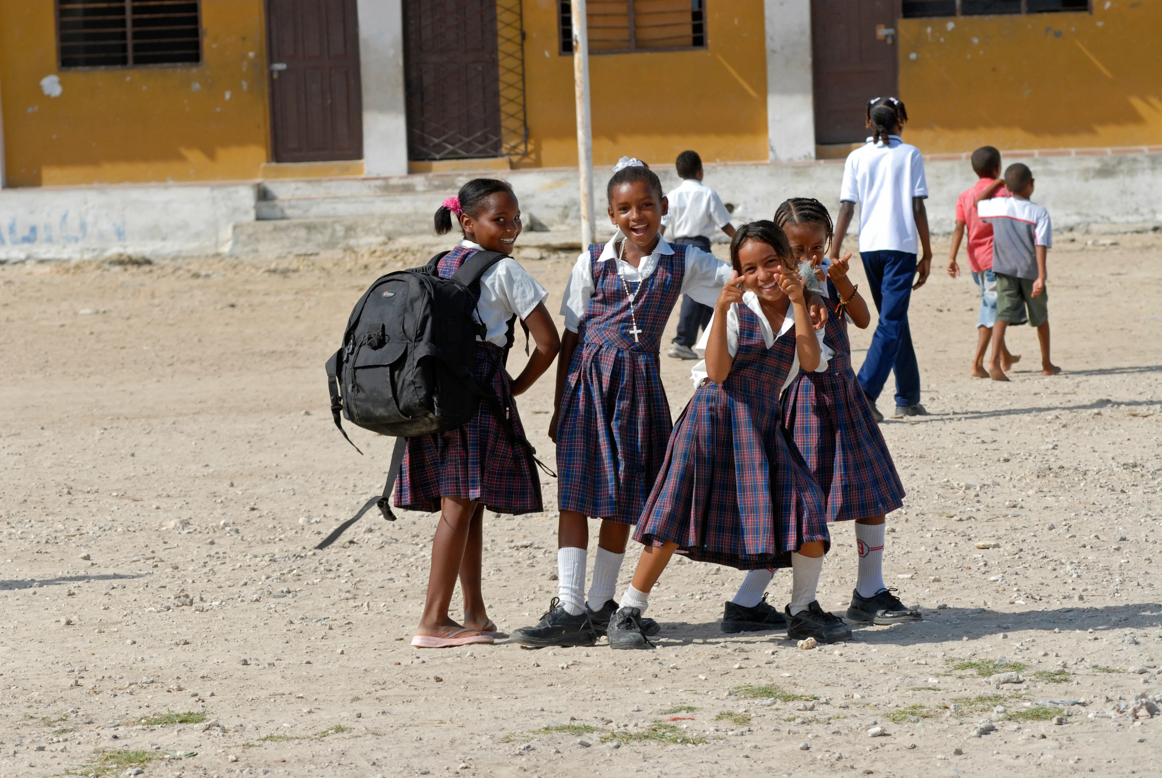 These girls are walking to school in Colombia. Have you noticed the necklace? It’s a rosary, a string of beads that Catholics use when they pray. It helps them feel closer to God and focus on their prayers. The cross shape is an important Christian symbol. Other religions use similar prayer beads, but without the cross.