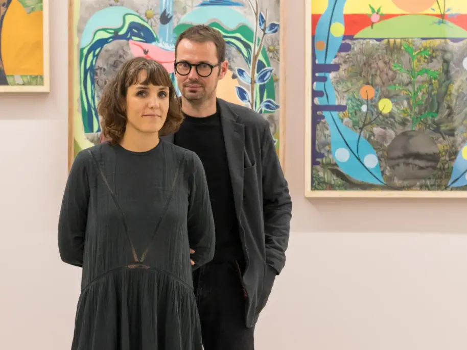 Portrait of the French artist-couple Florentine and Alexandre Lamarche, in front of some of their nature-inspired artworks