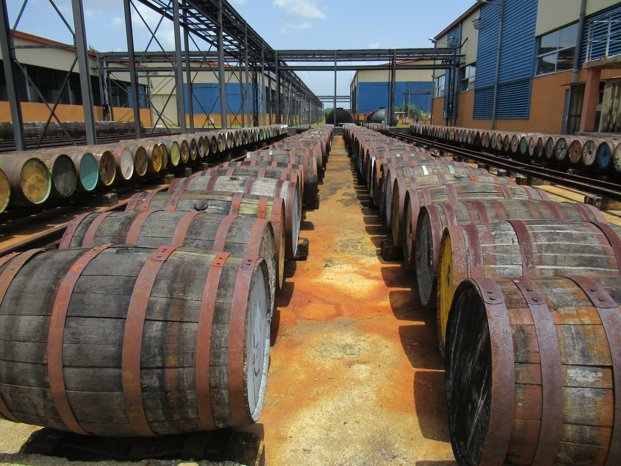 endless rows of barrels outside next to buildings