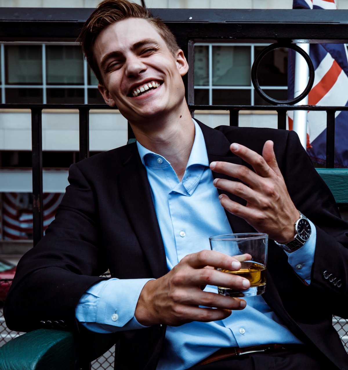 Millennial man whiskey suit UK flag