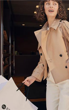 Woman with a shopping bag at Kildare Village.