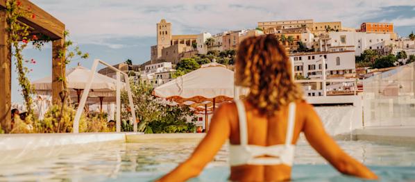 A woman in a hotel swimming pool in Ibiza