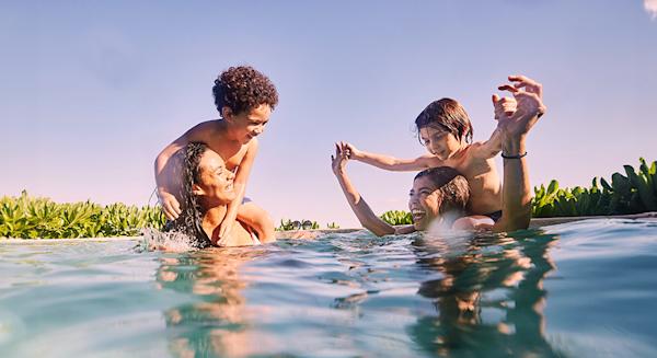 A family having fun in a hotel swimming pool